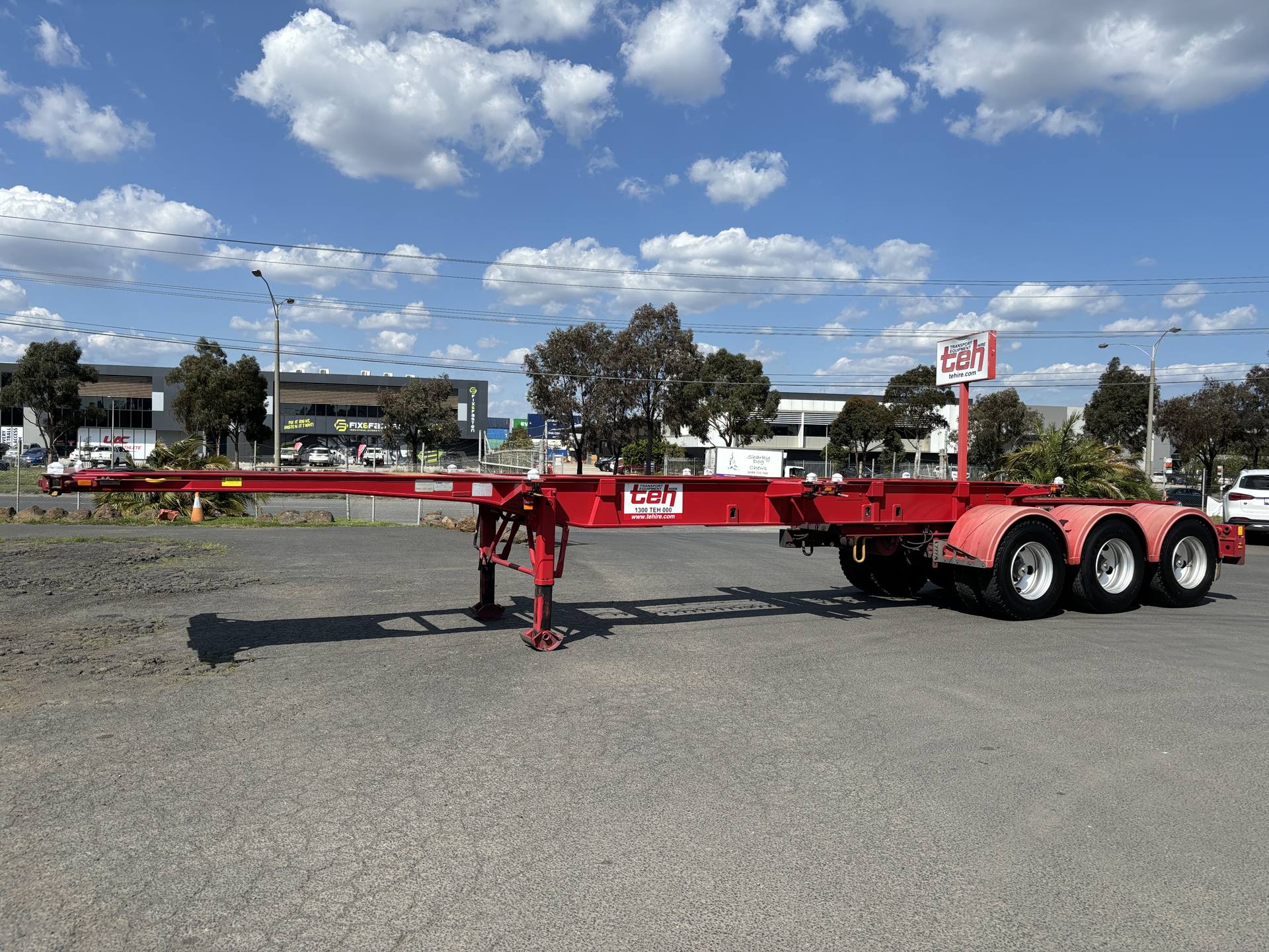 TEH retractable skeletal trailer in red at the Sunshine West depot